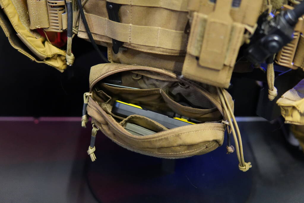 Tactical pouch with electronic equipment, batteries and cables inside