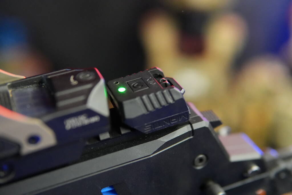 Mantis X10 training sensor mounted on the top Picatinny rail next to a Holosun HS510C optic on a Steambow PD-5.