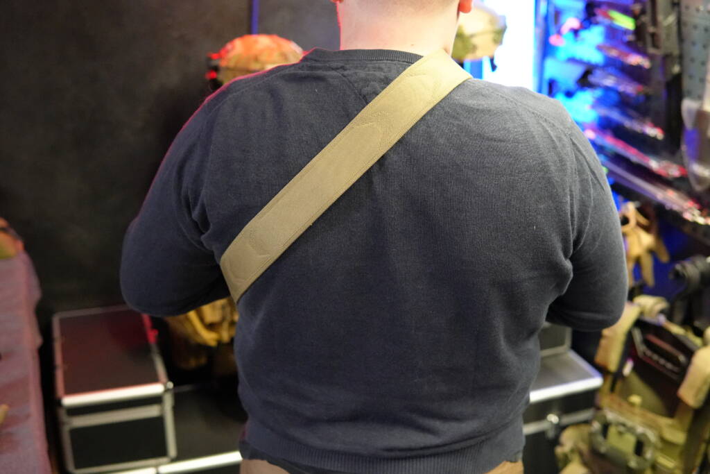 Agilite Reflex 3D Sling worn over the shoulder, showing padded and ventilated strap design in use.