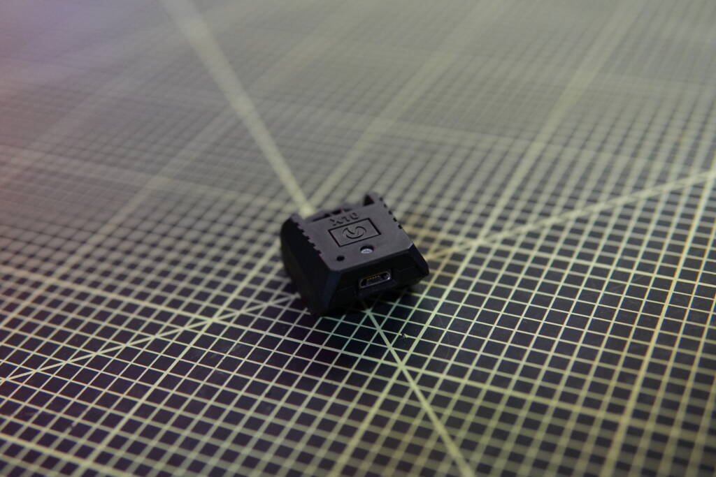 Mantis X10 Elite training sensor placed on a grid cutting mat.